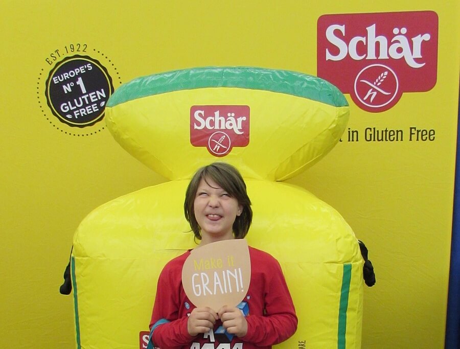 Remy making a silly face for the Schar photobooth; his photobooth prop reads "MAKE IT GRAIN"
