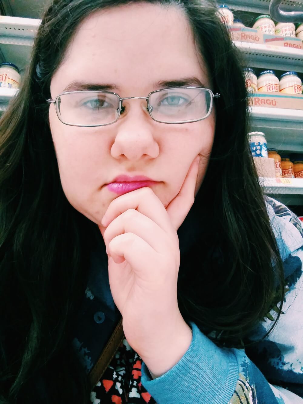 Nonchalant selfie while sitting in Walmart aisle on Black Friday
