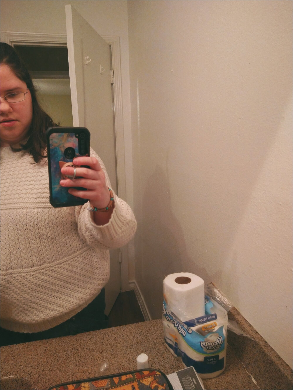 Bathroom mirror selfie, except mirror is broken